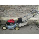 A Honda Izy petrol driven rotary lawn mower 5.5HP engine (starts/runs) probably in need of a