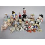 A collection of mainly early to mid-20th century novelty cake ornaments including Snow Babies,