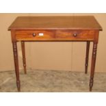 A 19th century mahogany side table fitted with two frieze drawers raised on ring turned and