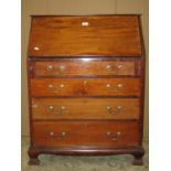 An Edwardian mahogany bureau in the Georgian style, the fall flap enclosing a simply fitted interior