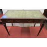A good quality reproduction 18th century style writing table with turret corners, raised on turned