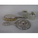 Two piece dressing set comprising brush and mirror embossed with scallop shell and scrolled