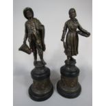 Pair of French spelter figures of a fisherman and his wife upon stepped bases, with band of cherubs,