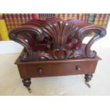 A Regency mahogany four divisional Canterbury, with carved and scrolled detail, over a single frieze