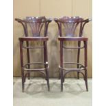A pair of bentwood stained beech high low chair back stools with fan shaped splats
