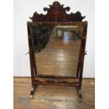 A 19th century mahogany and tortoiseshell dressing table mirror on a skeleton frame, 48cm wide