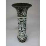 An unusual Royal Doulton vase of cylindrical form with flared neck and with moulded and painted