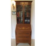 An inlaid Edwardian mahogany bureau bookcase with satinwood banding classical urn, tied ribbon and