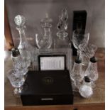 A mixed collection of glassware to include a hobnail cut ships decanter, various other decanters and