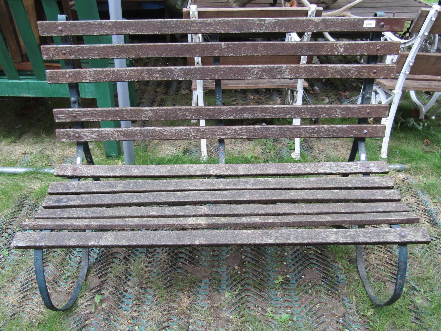 A three seat garden bench with weathered timber lathes and sprung steel supports, together with a - Image 2 of 2