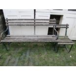 A three seat garden bench with weathered timber lathes and sprung steel supports, together with a