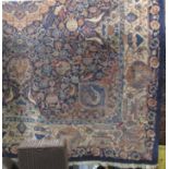 Large Keshan country house carpet, with various scrolled medallions, foliage and still life's upon a