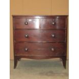 A small 19th century mahogany bow front bedroom chest of two short over two long drawers with shaped