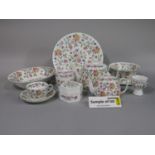 A quantity of Minton Haddon Hall pattern wares comprising circular serving platter, pair of oval