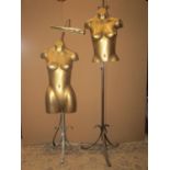 Two vintage moulded fibreglass female display torsos with gilt finish, raised on associated