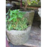 A weathered natural stone trough/planter of circular form 38 cm in diameter x 24 cm in height,