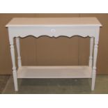 A two tier side table with painted finish and tapered supports, approx 100 cm long x 36 cm wide x 80