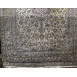 Full pile eastern carpet decorated with various scrolled blue foliage upon a cream ground, 360 x