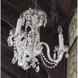 Venetian style three branch chandelier with various prismatic drops and scrolled branches, 45cm high