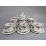 A collection of Royal Albert Moss Rose pattern teawares comprising teapot, milk jug, sugar bowl, six