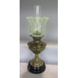 A good late 19th century brass oil lamp, with two vaseline shades, 46cm high including shades