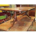 A 19th century mahogany D end extending dining table with two additional leaves, raised on twin