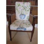 An Edwardian mahogany bergere armchair, with caned panels, the frame with string inlay detail,