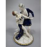 A Royal Dux figure group of a pair of male and female dancers in exotic blue and gilt costume,