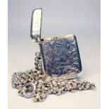 EDWARDIAN SILVER VESTA WITH ENGRAVED MONOGRAM 'JK', CHASED SCROLL AND FLORAL DECORATION, BY J.C LTD,