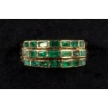 A THREE ROW EMERALD RING, THREE ROWS OF HORIZONTALLY SET EMERALDS, WEIGHING AN ESTIMATED TOTAL OF