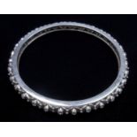 A DIAMOND SET FIXED BANGLE, SET WITH THIRTY-TWO ROUND BRILLIANT CUT DIAMONDS, WEIGHING AN