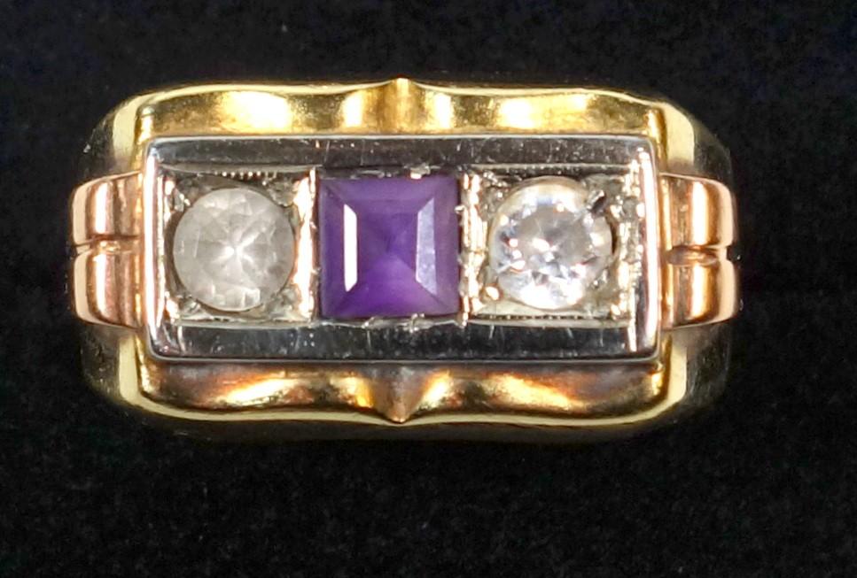 YELLOW METAL RING SET AMETHYST AND TWO WHITE STONES, STAMPED 750, GROSS 6.2 GRAMS.