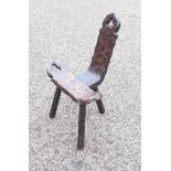 RUSTIC WAXED PINE THREE LEGGED CHAIR WITH A SLANTING BACK AND PIERCED TREFOIL DECORATION (H.74 CM)