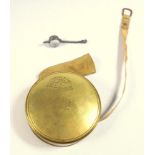 A BRASS CASED TAPE MEASURE, WITH PATENT CATTLE GAUGE, CHESTERMAN, SHEFFIELD, THE FACE UNSCREWING