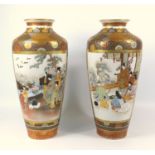 PAIR OF JAPANESE PORCELAIN TAPERING CYLINDRICAL VASES, EACH PAINTED WITH RESERVES OF FIGURES IN AN