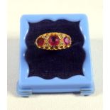 EDWARDIAN 18 CT GOLD RING SET THREE RUBIES, BY SWG & CO., BIRMINGHAM 1905, GROSS 2.9 GRAMS