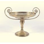 EDWARDIAN SILVER CIRCULAR PEDESTAL SWEETMEAT DISH WITH A PIERCED LATTICE RIM AND TWO SCROLL HANDLES,