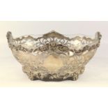 LATE VICTORIAN SILVER PIERCED OVAL BOWL WITH PIERCED SCROLL AND FLORAL DECORATION AND A SHAPED