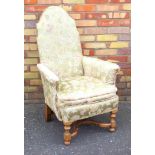 WILLIAM & MARY STYLE ARMCHAIR WITH AN ARCHED BACK, UPHOLSTERED IN FLORAL FABRIC, ON OCTAGONAL