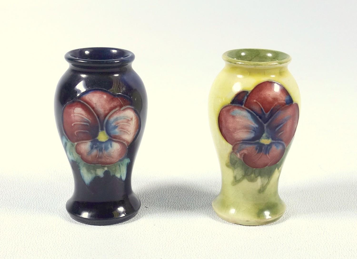 MOORCROFT EARTHENWARE MINIATURE BALUSTER VASE PAINTED WITH TWO NASTURTIUMS ON A DARK BLUE GROUND (H.