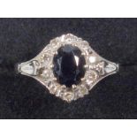 18 CT WHITE GOLD RING SET OVAL CUT SAPPHIRE WITH A BAND OF TEN DIAMONDS, GROSS 3.2 GRAMS.