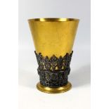 VICTORIAN ELKINGTON & CO. GILT BRONZE TAPERING CYLINDRICAL BEAKER WITH A SILVER PLATED BAND OF MASKS