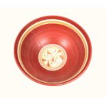 GUILD OF DEVON CRAFTSMEN EARTHENWARE CIRCULAR BOWL WITH RED, WHITE AND GILT BANDS ON A CIRCULAR