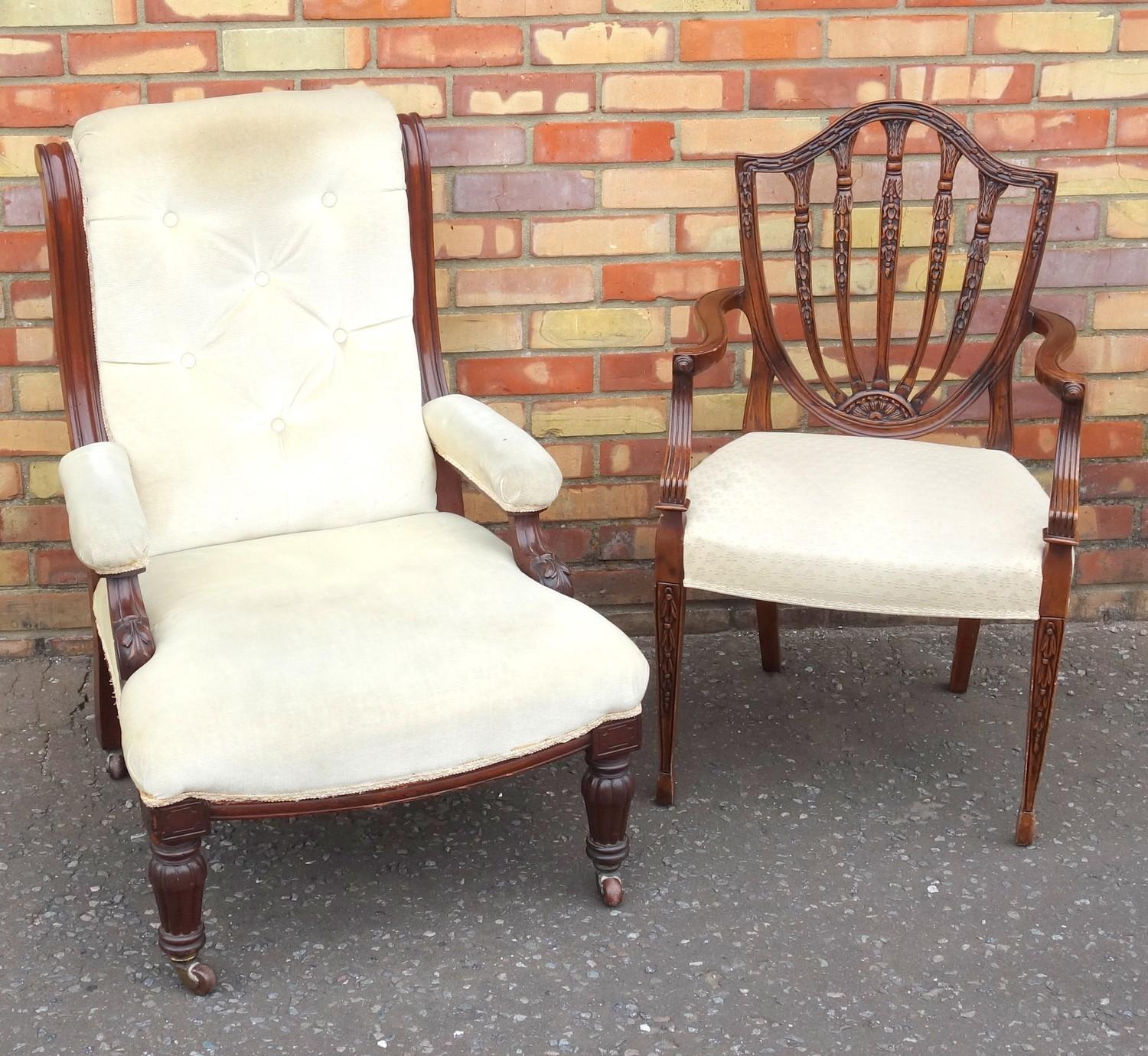 HEPPLEWHITE STYLE CARVED MAHOGANY OPEN ARMCHAIR WITH A BELLFLOWER SPLAT ARCHED SHIELD BACK AND