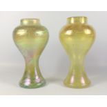 TWO HANDBLOWN GREEN AND YELLOW IRRIDESCENT GLASS VASES OF WAISTED BALUSTER FORM WITH A WAVY TRAILING