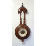 VICTORIAN BAROMETER WITH A CIRCULAR WHITE DIAL ENCLOSING AND ANEROID BAROMETER WITH A THERMOMETER