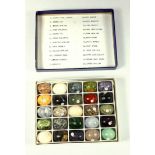 SET OF TWENTY FIVE NUMBERED MINERAL SPECIMENS IN THE FORM OF EGGS (L.2.5 CM), WITH LIST, BOXED (26)