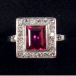 WHITE METAL RING SET RECTANGULAR CUT RUBY STONE 7 X 6 MM AND TWENTY FOUR DIAMONDS, STAMPED 'PLAT',