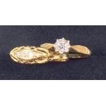 9 CT GOLD RING WITH ILLUSION SET DIAMOND, AND A YELLOW METAL RING SET FOUR DIAMONDS (ONE MISSING)