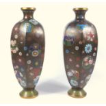 PAIR OF JAPANESE CLOISONNE HEXAGONAL SHAPED VASES, EACH WITH ALL-OVER FLORAL DECORATION ON A BLACK